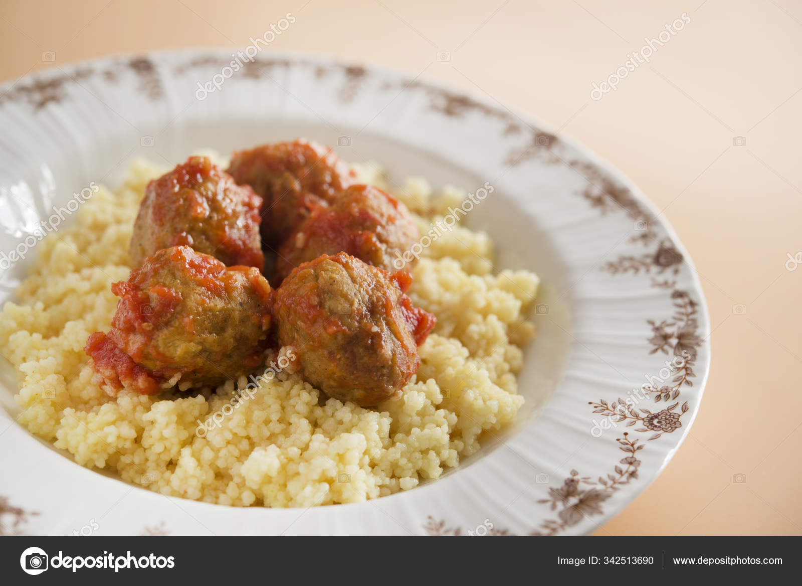 Meatballs with typical Moroccan couscous Stock Photo by ©Dalaifood