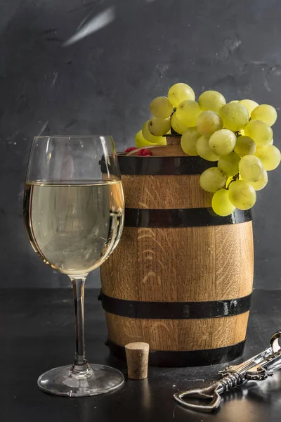 Glasses of white wine with  cask Royalty Free Stock Images