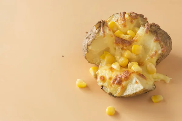 Jacket potatoes with cheese and corn