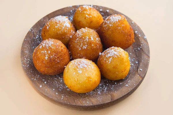 French doughnuts Beignet covered with sugar powder on a brown ba — Stock Photo, Image