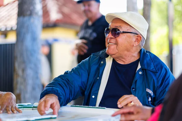 Elderly domino player — Stock Photo, Image