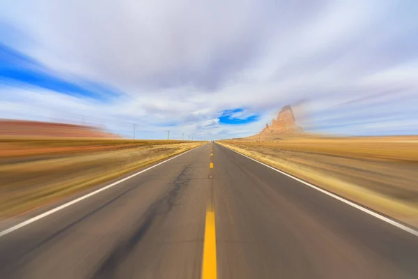 Rural two lane highway with motion blur in the Arizona desert.