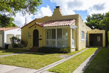 Coral Gables, Florida USA - March 14, 2020: Classic mediterranean architecture style home in the historic City of Coral Gables located in Miami. clipart