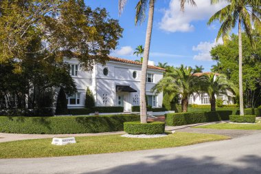Coral Gables, Florida USA - March 16, 2020: Classic Art Deco architecture style home in the historic City of Coral Gables located in central Miami. clipart