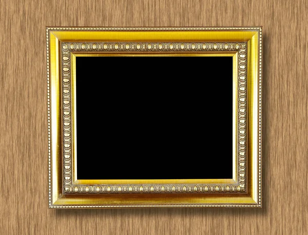 gold frame on the wood background.