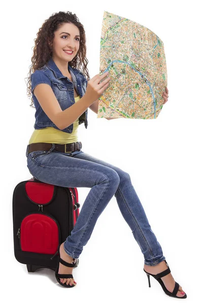 The girl looks at the map — Stock Photo, Image