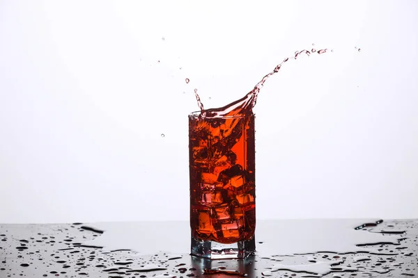 A glass of juice, with ice — Stock Photo, Image