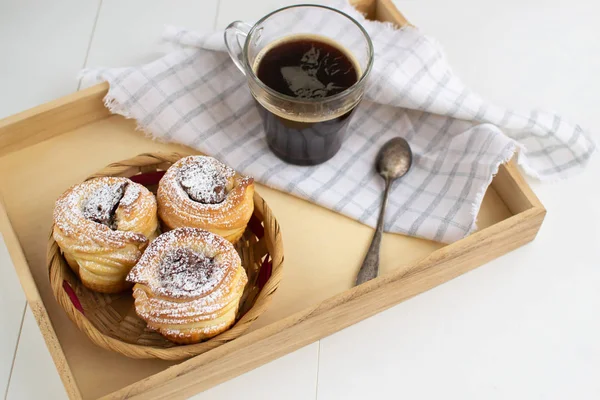 Cruffins with nut paste filling with a cup of espresso on a wood — Stock Photo, Image