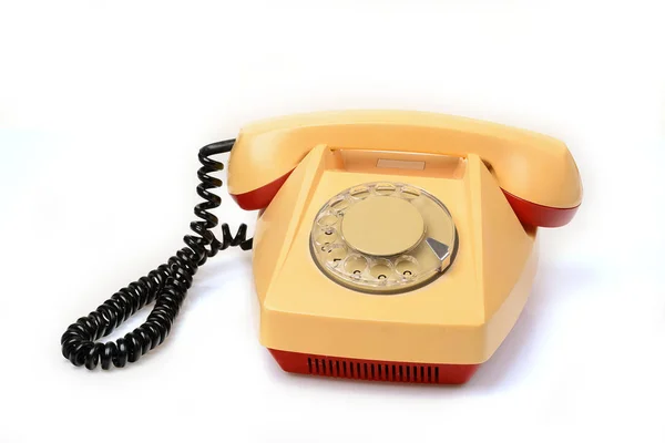 Старый ротационный телефон на белом — стоковое фото