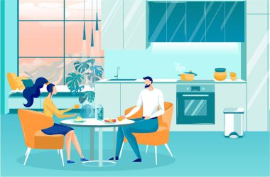 Young Couple Having Breakfast at Home in Apartment