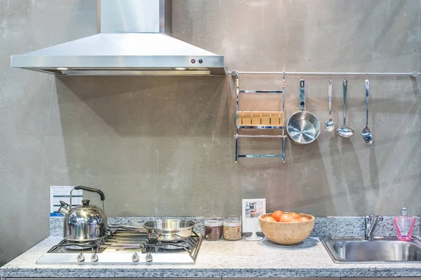 Interior of kitchen with cooker hood, gas stove snd sink at home — Stock Photo, Image