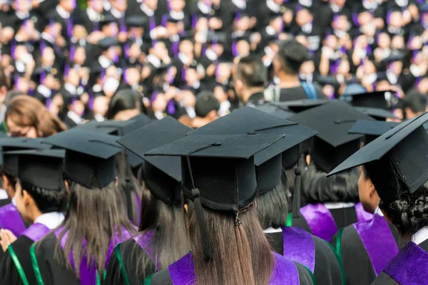 Back of graduates during commencement at university. Close up at — Stock Photo, Image