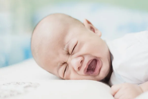 Portrait of 3 months Asian baby boy crying in bedroom. — Stock Photo, Image