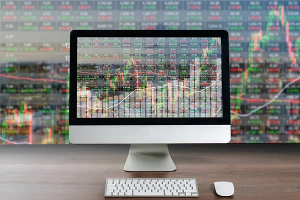 Business computer on wood table showing business trading graph w — Stock Photo, Image