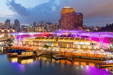 Colorful light building at night in Clarke Quay, Singapore. Clar clipart