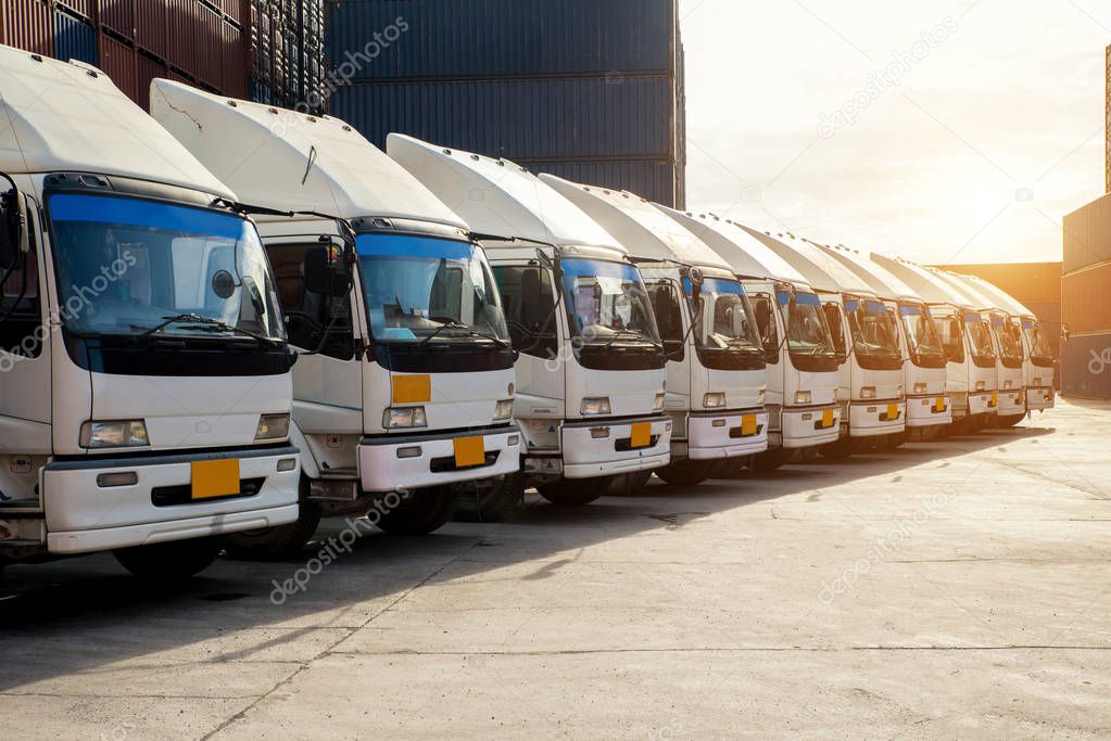 Container truck in depot at porrt. Logistics import export backg