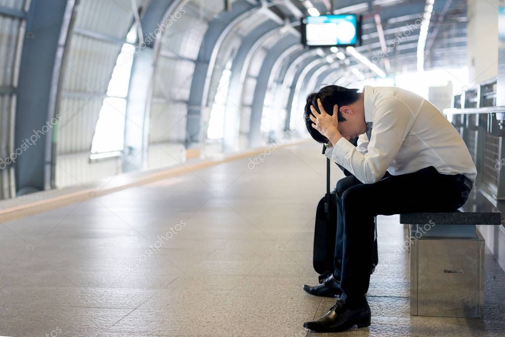 Train delay or problem in the train station, tired desperate Ais