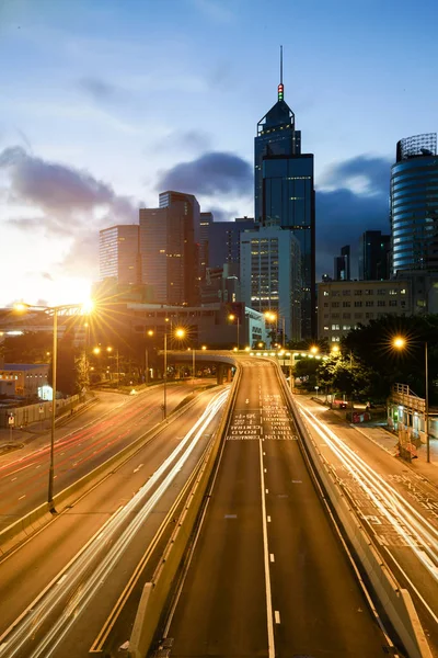 Light trails of traffic in Hong Kong at sunset time with Hong Ko — Stock Photo, Image