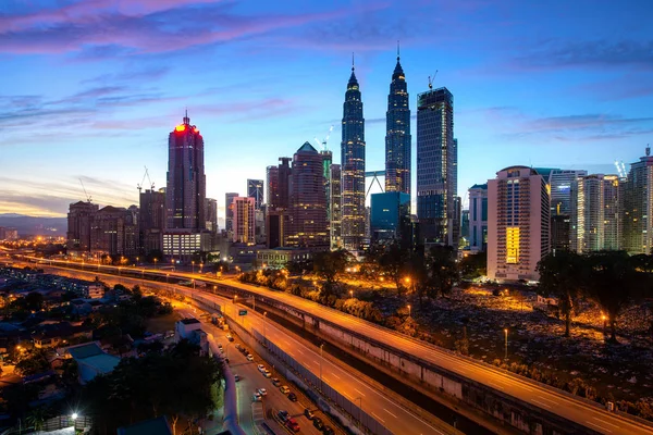 Kuala Lumpur city skyscraper and highway street with nice sky su — Stock Photo, Image