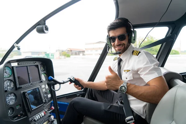 Portrait of handsome commercial pilot in captain white uniform — 스톡 사진