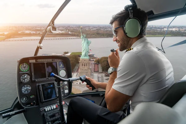 Helicopter cockpit with pilot arm and control console inside the