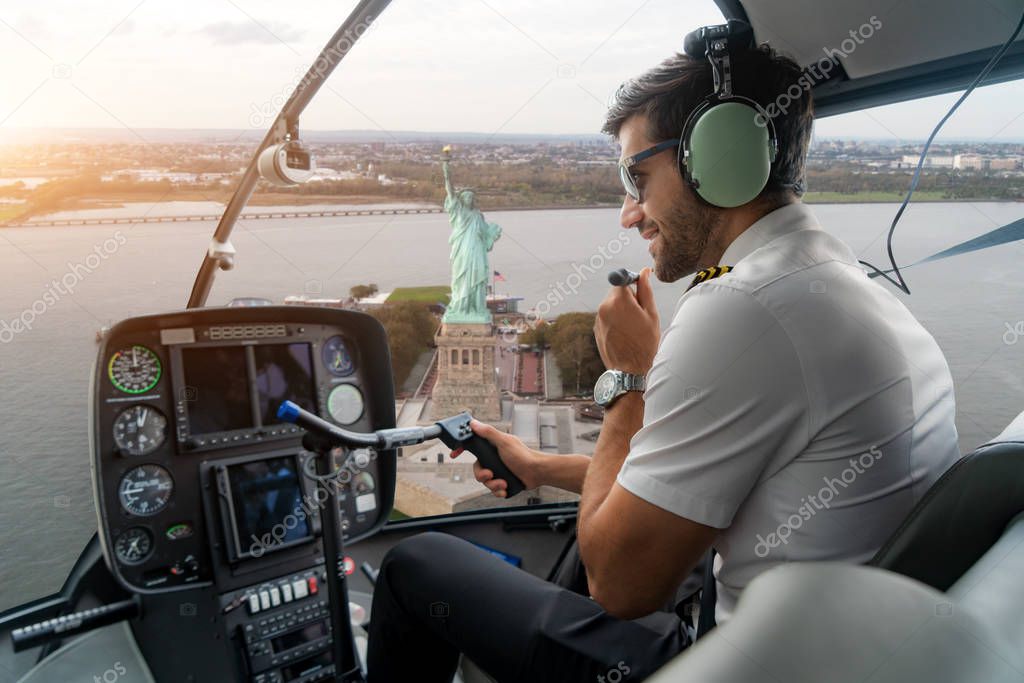 Helicopter cockpit with pilot arm and control console inside the