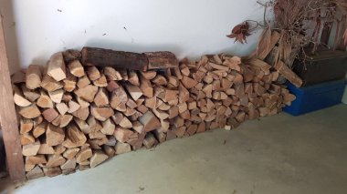 firewood and pile of wood logs for heating