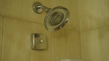 a white toilet machine with a handle in the door in the bathroom.