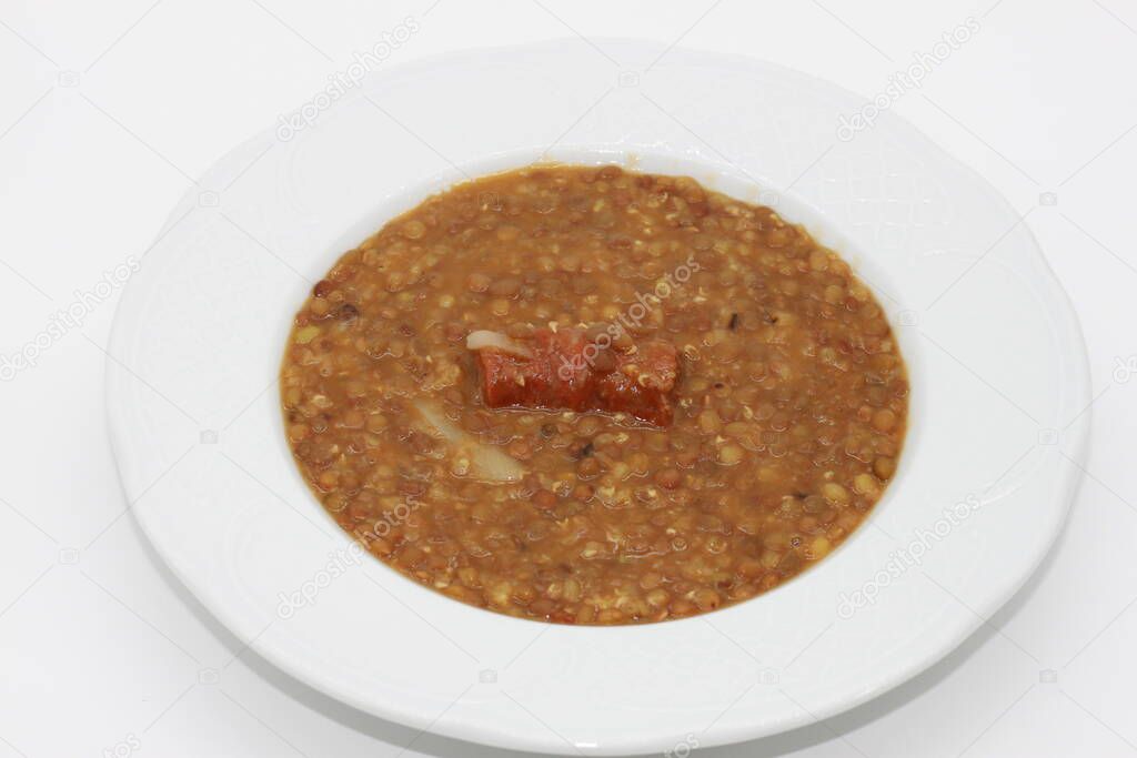 plate of lentils with cooked chorizo