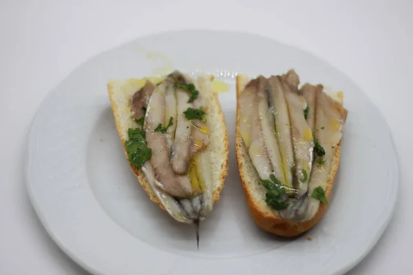 marinated anchovies on freshly toasted bread