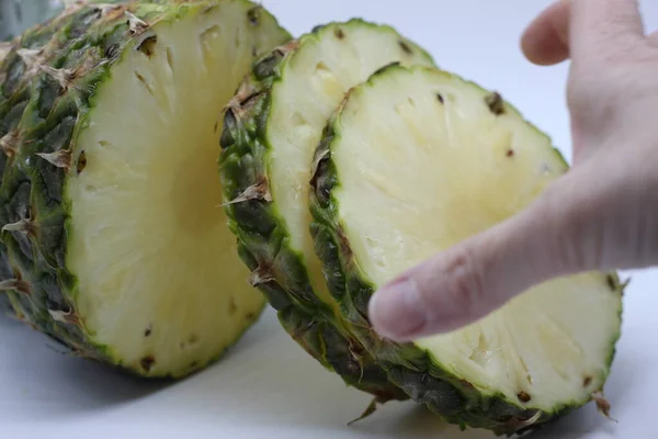 Hand Picking Pineapple Slice White Background — Stock Photo, Image