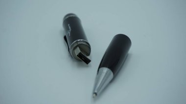 black and white pencil pen and a fountain isolated on a blue background.