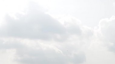 One fighter jets in the blue sky. A general plan. Aerobatic figures. Airshow. 10 seconds