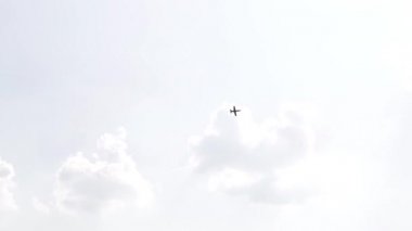 One fighter jets in the blue sky. A general plan. Aerobatic figures. Airshow. 11 seconds
