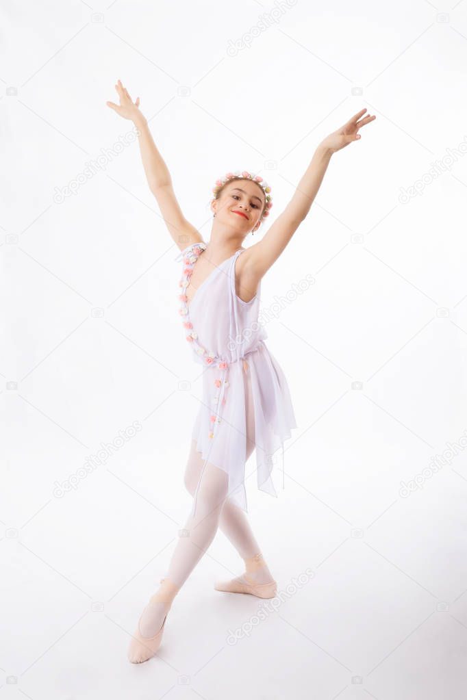 Ballerina  is dancing on a white 