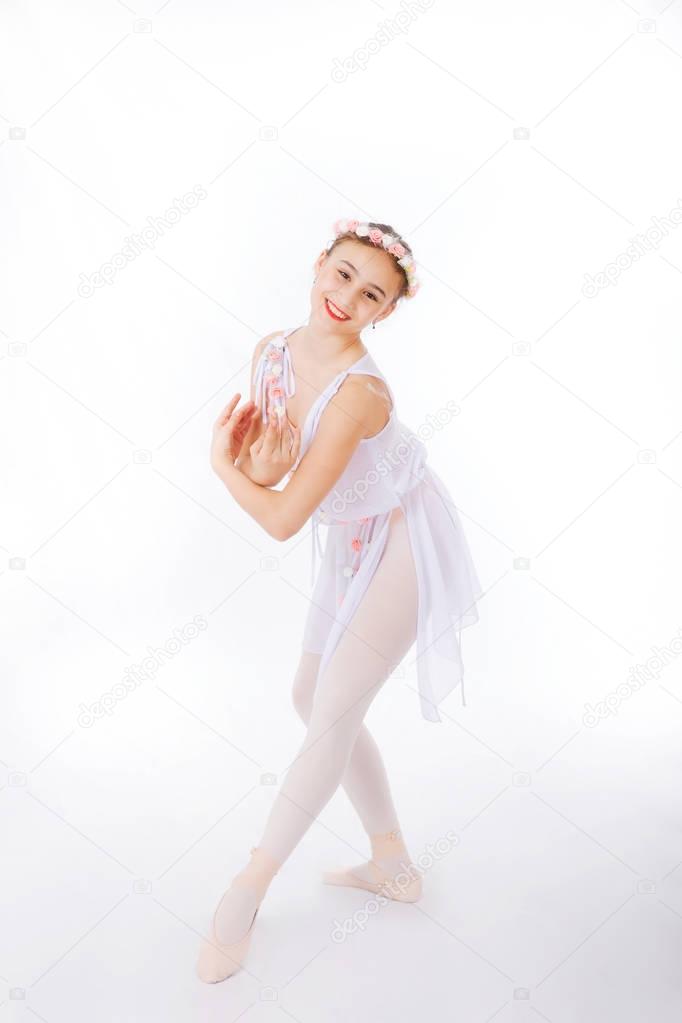 Ballerina  is dancing on a white 