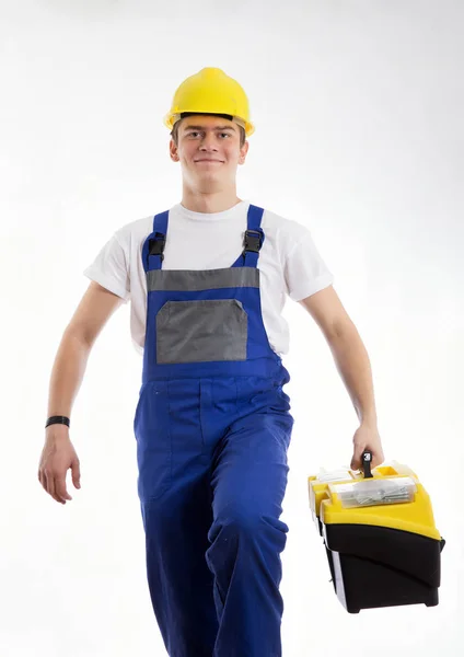 Bauarbeiter mit einem Sack voller Werkzeuge geht ans Werk — Stockfoto