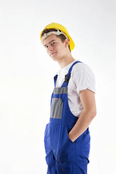 Construtor de pé em um terno azul em um fundo branco — Fotografia de Stock
