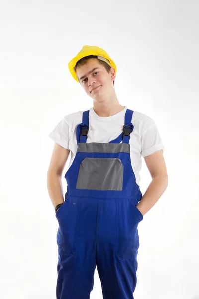 Construtor de pé em um terno azul em um fundo branco — Fotografia de Stock