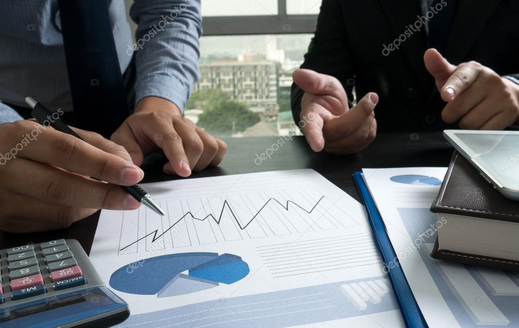 Image of male hand pointing at business document