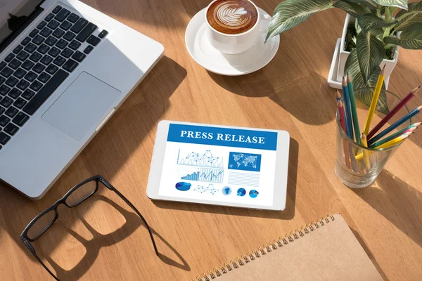 Tablet on a desk - Press Release Concept — Stock Photo, Image