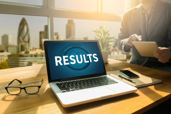 Business team hands at work with financial reports and a laptop — Stock Photo, Image