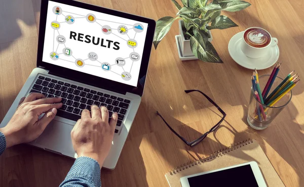 Business team hands at work with financial reports and a laptop — Stock Photo, Image