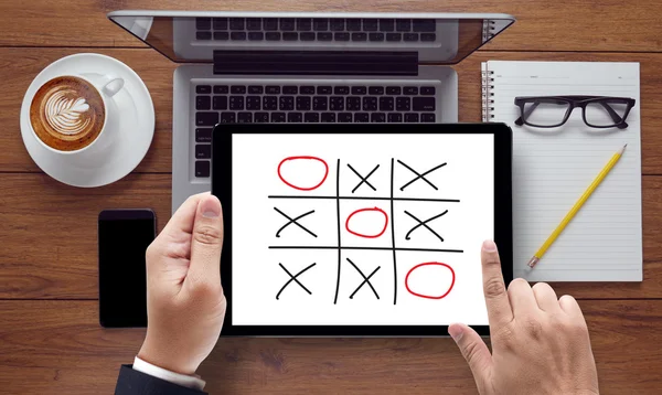 Business team hands at work with financial reports and a laptop — Stock Photo, Image