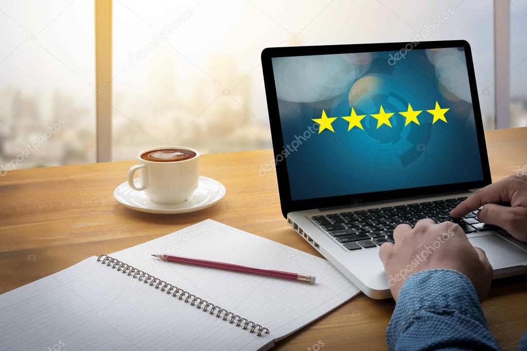 Businessman holding five star rating,Review, increase rating or 