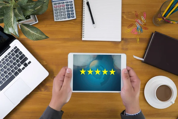 Businessman holding five star rating,Review, increase rating or