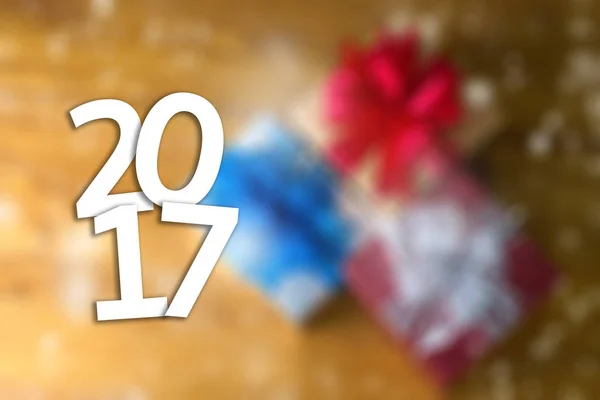 2017 Happy New Year Holiday on blur bokeh and box background wit