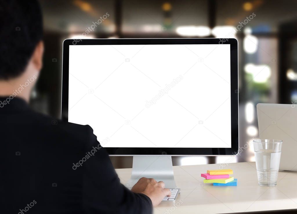 young man working Businessman using a desktop computer of the bl