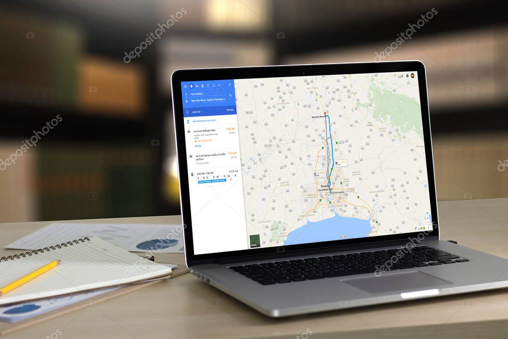BANGKOK, THAILAND -1 JUNE 2016: Close up of man use and computer iphone smartphone and using application Google Maps to destination. navigation service by Google map