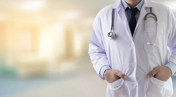 Closeup Doctor in blurred of hospital colleague and hand holding — Stock Photo, Image